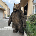 Load image into Gallery viewer, Large bear costume standing on two legs in an urban setting