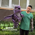 Bild in Galerie-Betrachter laden, Person holding a large purple dragon plush toy outdoors.
