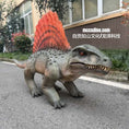 Load image into Gallery viewer, Dinosaur model with a red spiked back on a street