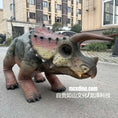 Load image into Gallery viewer, Dinosaur costume on a person in an urban setting with buildings and cars in the background