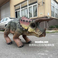 Load image into Gallery viewer, Dinosaur costume on a person in front of a building