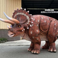 Load image into Gallery viewer, Dinosaur costume with large horns and spikes on a street
