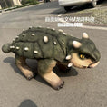 Load image into Gallery viewer, Dinosaur toy on a street with a car in the background