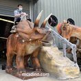 Load image into Gallery viewer, kid riding triceratops Dino ride