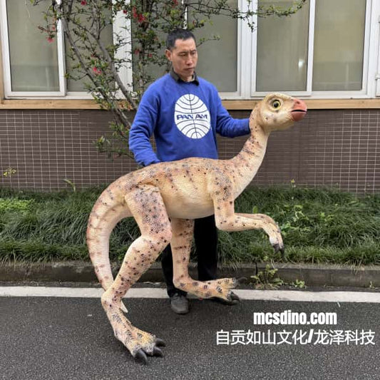 Person standing next to a dinosaur model on a street
