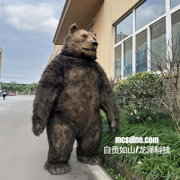 Stuffed bear standing on its hind legs in front of a building