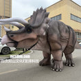 Load image into Gallery viewer, Dinosaur costume in front of a building
