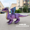 Cargar la imagen en la vista de la galería, Purple dinosaur costume on a street with buildings in the background
