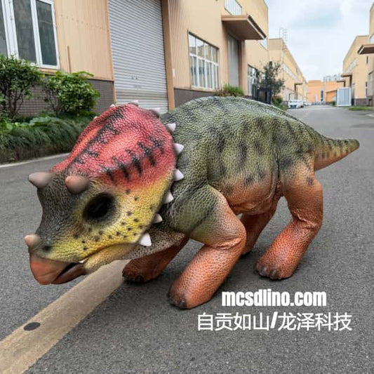 Dinosaur model on a street with buildings in the background