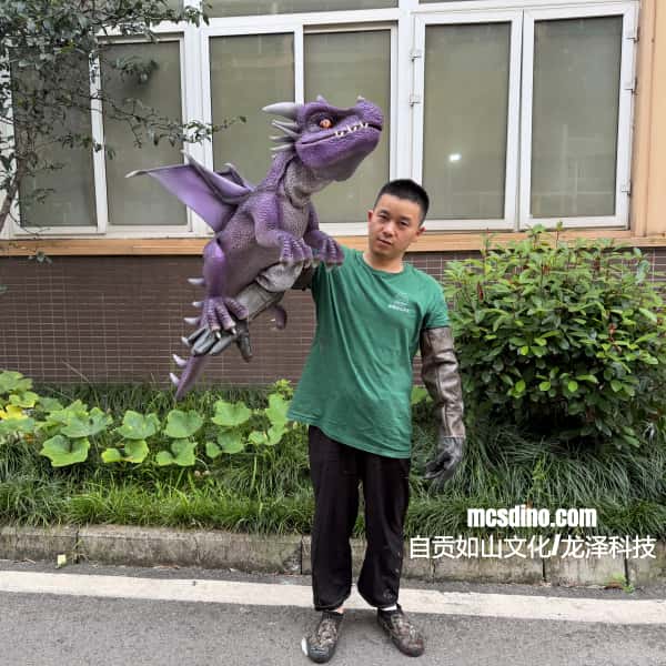 Person holding a purple dinosaur toy in front of a building