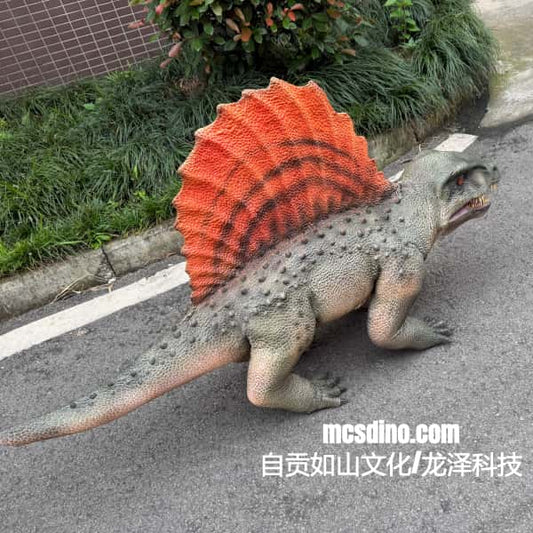Model of a dinosaur with an orange sail on a road