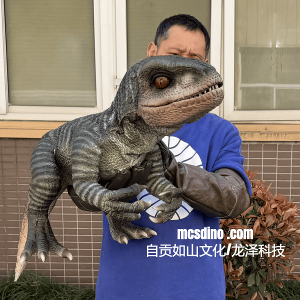 Person holding a dinosaur costume in front of a building