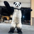 Load image into Gallery viewer, Person wearing a panda costume standing in an outdoor setting with a building in the background.
