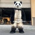 Load image into Gallery viewer, Panda costume in front of a garage door with visible branding.
