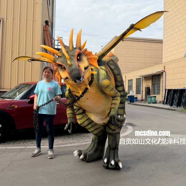 Person standing next to a large dinosaur costume on a street