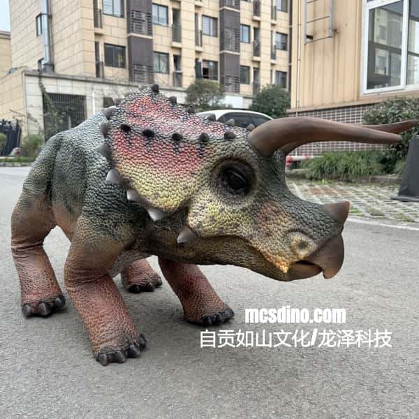 Dinosaur costume on a person in an urban setting with buildings and cars in the background