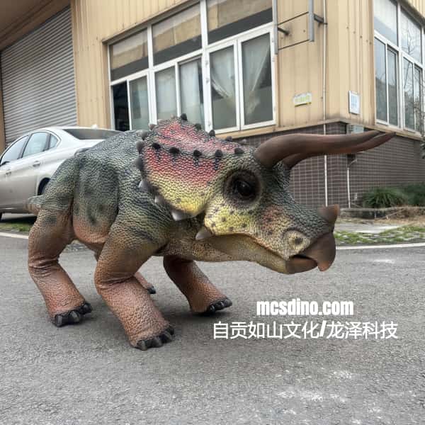 Dinosaur costume on a person in front of a building