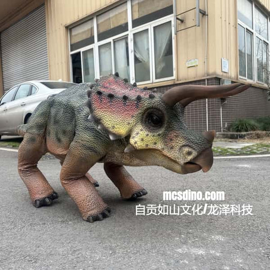 Dinosaur costume on a person in front of a building