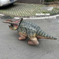 Load image into Gallery viewer, Dinosaur toy on a street with visible branding
