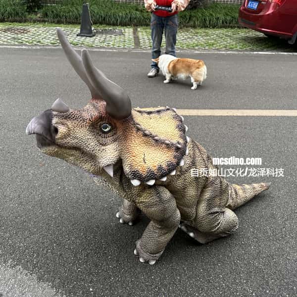 robot dog in a dinosaur costume on a street