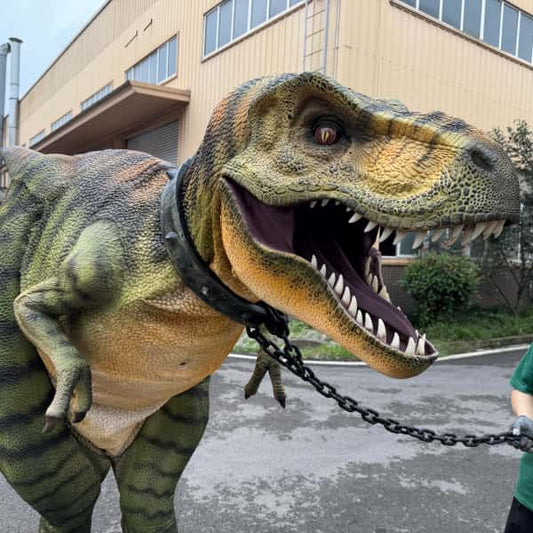 Person in a dinosaur costume being pulled by a chain in an urban setting