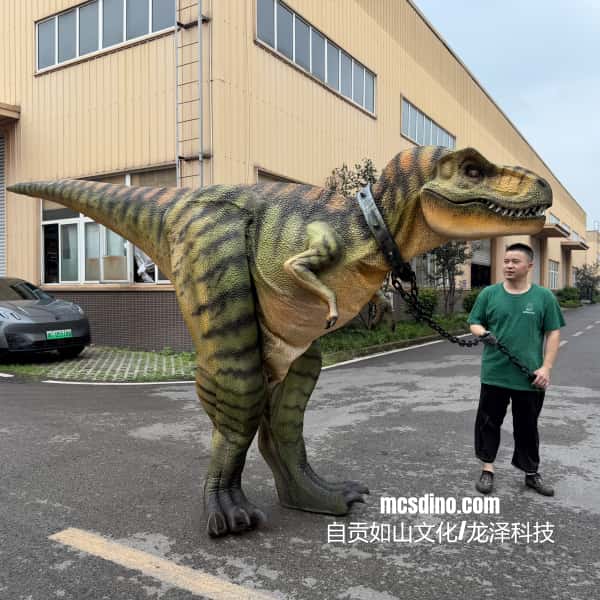 Person standing next to a large dinosaur costume in an outdoor setting
