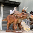 Carica l'immagine nel visualizzatore della galleria, kid riding triceratops Dino ride
